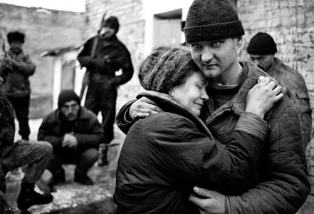 The mother of a Russian soldier is reunited with her son after he was held captive in the Chechen town of Shali, during the first Chechen war.