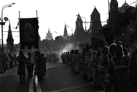 MOSCOW, 27.06.04. Some tens thousand believers have taken part in Moscow in Religious procession in honour of wires of wonder-working Tikhvin icon God Mother from Moscow to Petersburg. Religious procession from the Temple of the Christ of the Savior where has taken place before wonder-working image, has headed the Patriarch Moscow and all Russia Alex Vtoroj. All clergy of Moscow, and also representatives of dioceses of Russian orthodox church has taken part in it and others local orthodox churches. The procession has passed from the Temple of the Christ of the Savior on the Kremlin quay to the Red square. The quay has been densely filled with believers who went even on a lawn along the Kremlin walls. Believers have filled also in all Red square where one more has taken place , devoted to wires of the Wonder-working image of an icon of the Virgin which has returned to Russia on June, 23, later 63 years of stay outside the country. In January of this year during negotiations of Patriarch Alex II with delegation of Orthodox Church in America the final agreement on returning Tikhvin icon to Russia has been achieved. On June, 23 the relic has been delivered to Moscow, in a temple of the Christ of the Savior. 
(Photo by Oleg Klimov/Pressphotos)

