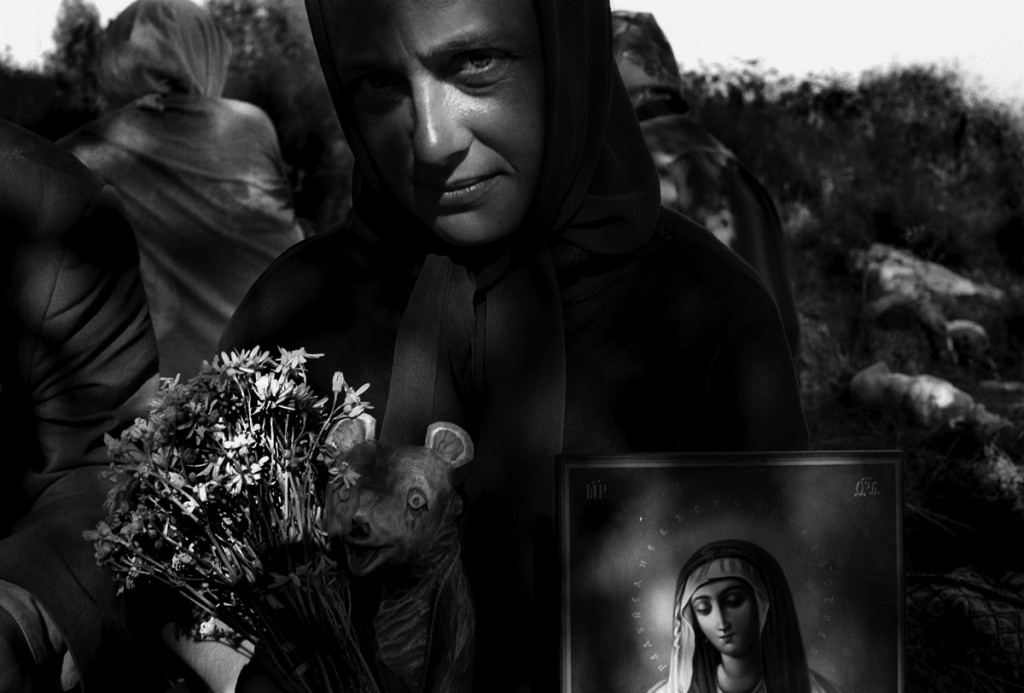 Theme: Russian’s believers. Pilgrim take a rest on the field during religious procession  from Kursk to Diveevo (distance about 900 km) for the celebration
of the 100th anniversary of the glorification of St. Seraphim of Sarov will take place in June-
August 2003.
29.07.2003
(Photo by Oleg Klimov/Pressphotos)

